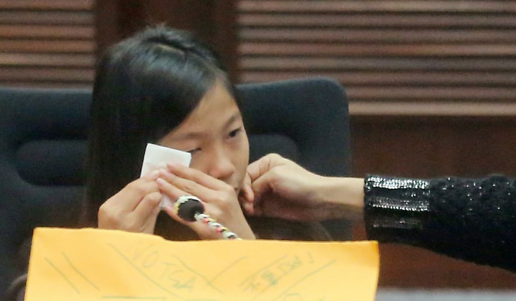 A student attending a special Legislative Council meeting on recommendations made by the Committee on Prevention of Student Suicides becomes emotional while recounting how going to a local school was like being in prison, on January 7. Photo: Handout