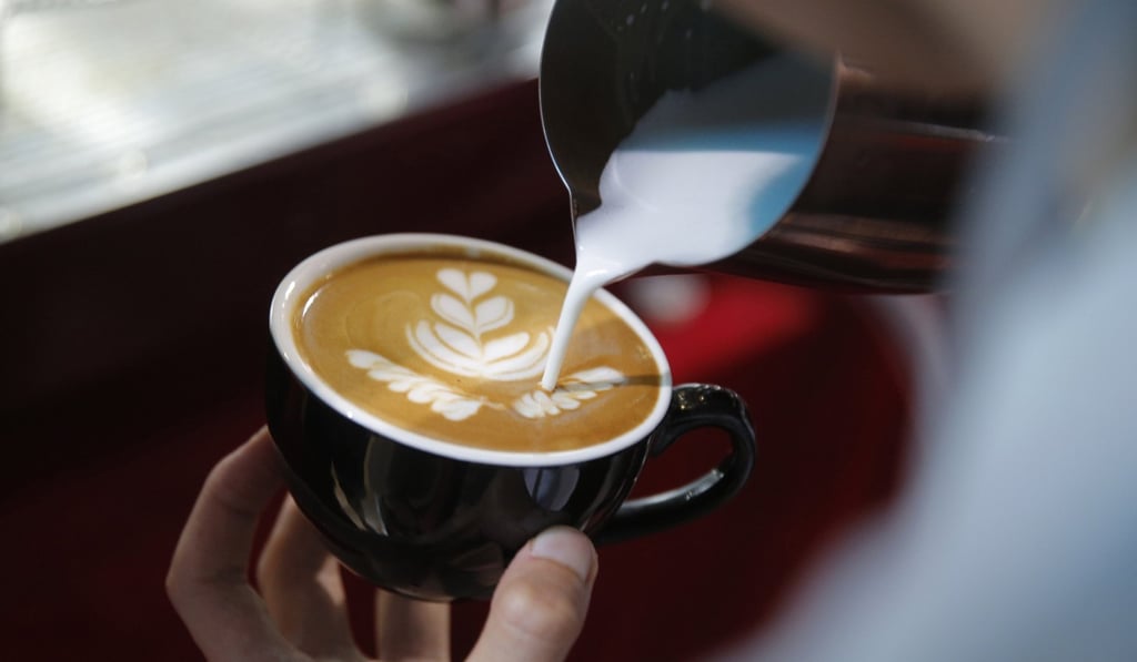 A barista makes coffee at show in Beijing, last week. Photo: EPA