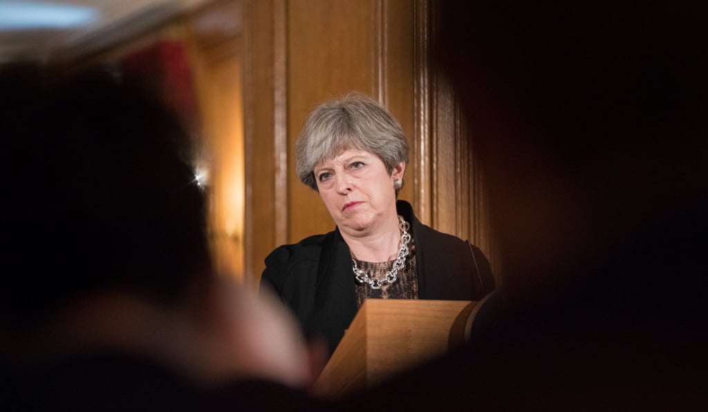 Britain's Prime Minister Theresa May said Anne Marie Morris’ use of racist language in a “wood pile” analogy was “completely unacceptable”. Photo: EPA