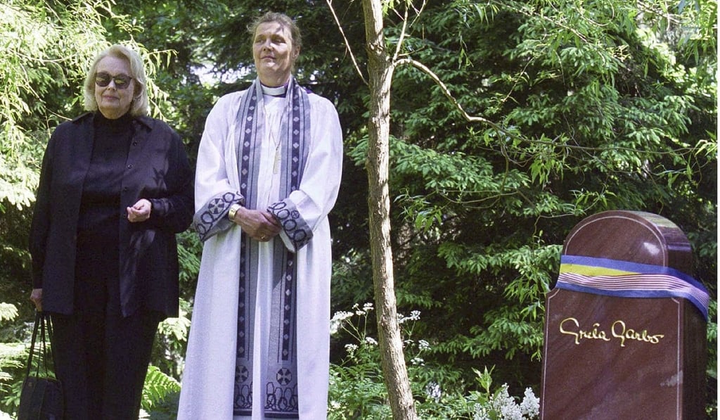 In this June 17, 1999 file photo, Gray Gustafson Reisfield, left, and Bishop Caroline Krook stand next to the tombstone of Greta Garbo after the memorial service at the Woodland Cemetery in Stockholm, Sweden. Photo: AP In this June 17, 1999 file photo, Gray Gustafson Reisfield, left, and Bishop Caroline Krook stand next to the tombstone of Greta Garbo after the memorial service at the Woodland Cemetery in Stockholm, Sweden. Photo: AP