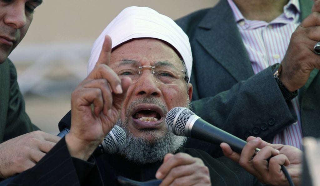Senior Egyptian cleric Sheik Youssef el-Qardawi speaks to the crowd as he leads Friday prayers in Tahrir Square in Cairo, Egypt, in 2011. A diplomatic standoff between Qatar and a quartet of Arab nations accusing it of sponsoring terrorism has thrust a spotlight on an opaque network of charities and prominent figures freely operating in Qatar, as well as individuals once embraced by leaders across the Gulf. Photo: AP