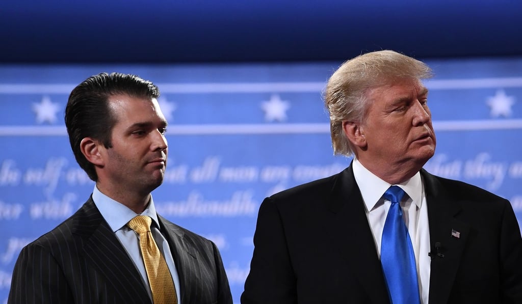 This file photo taken on September 26, 2016, shows Republican nominee Donald Trump (right) standing with his son Donald Trump Jnr after the first presidential debate at Hofstra University in Hempstead, New York. Photo: AFP