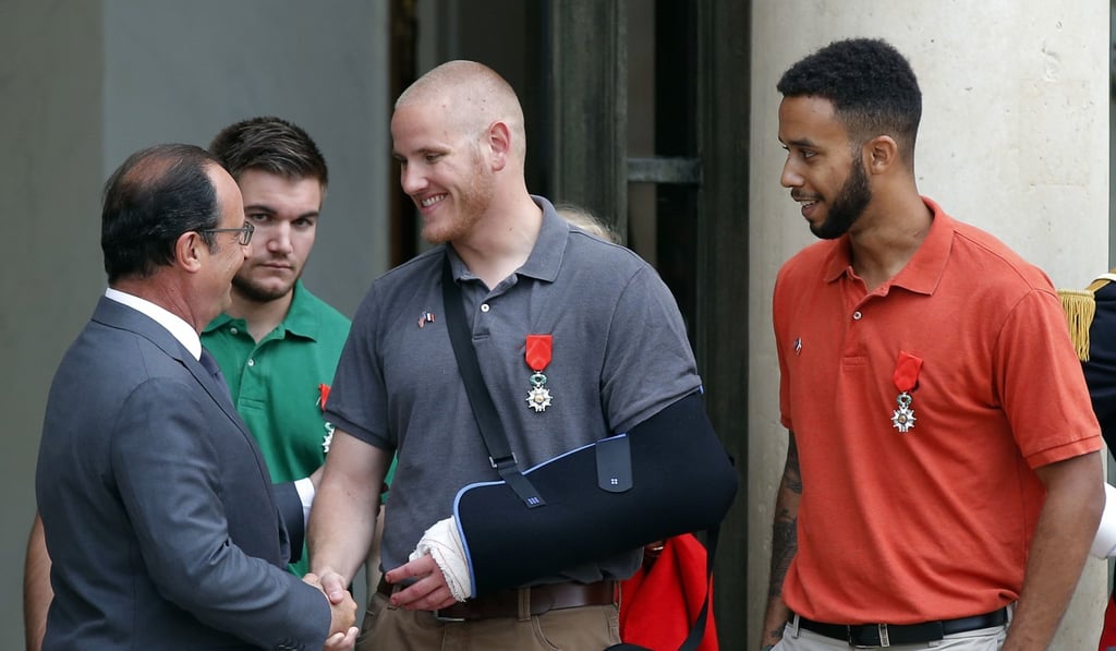 In this August 24, 2015 photo, French President Francois Hollande congratulates Spencer Stone (centre) as Alek Skarlatos and Anthony Sadler look on, after Hollande awarded the American trio the French Legion of Honor at the Elysee Palace in Paris. Photo: AP