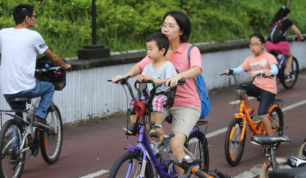 A woman goes for a spin along a bicycle track in Sha Tin. Photo: Sam Tsang