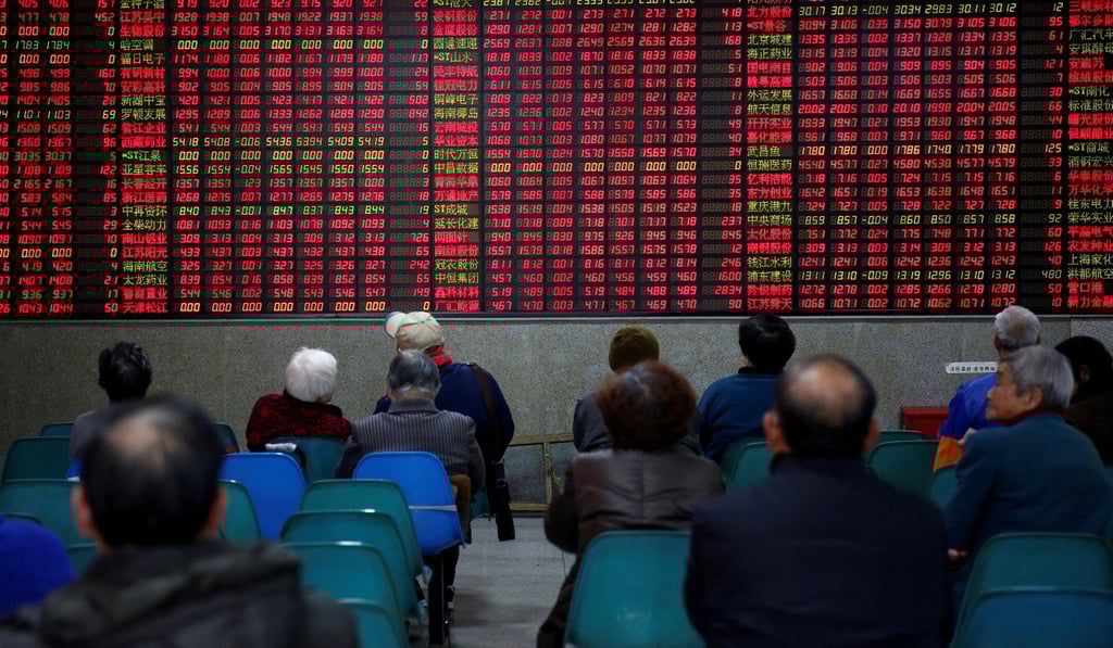 Investors gather on the first trading day after the New Year holiday at a brokerage house in Shanghai, on January 3. China’s equity and bond markets are among the biggest globally and are almost entirely funded by domestic investors. Photo: Reuters