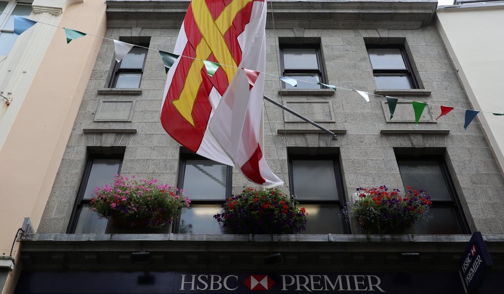 A Guernsey flag flies above a Premier branch of the HSBC Bank in Saint Peter Port in Guernsey, one of the Channel Islands. Photo: Reuters