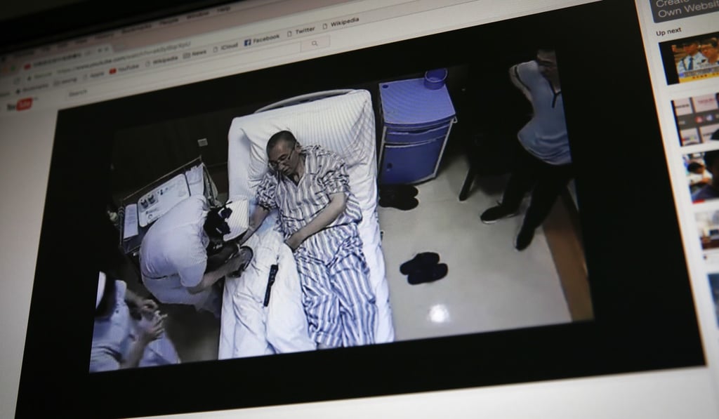 An online video clip shows China's jailed Nobel laureate Liu Xiaobo lying on a bed receiving medical treatment. Photo: AP