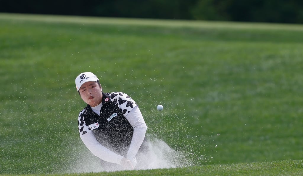Feng Shanshan hits from a bunker on the fourth hole. Photo: AFP