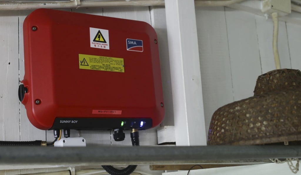 The red box is an inverter that converts DC electricity from the solar panel into AC electricity used in the home. Photo: May Tse