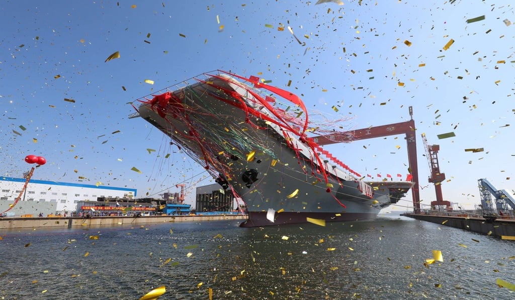 China’s new aircraft carrier is transferred from a dry dock into the water at a launch ceremony in Dalian, Liaoning province. Photo: Xinhua China’s new aircraft carrier is transferred from a dry dock into the water at a launch ceremony in Dalian, Liaoning province. Photo: Xinhua