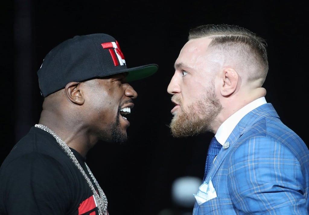 Floyd Mayweather and Conor McGregor square up to each other during a press conference in Canada. Photo: USA Today