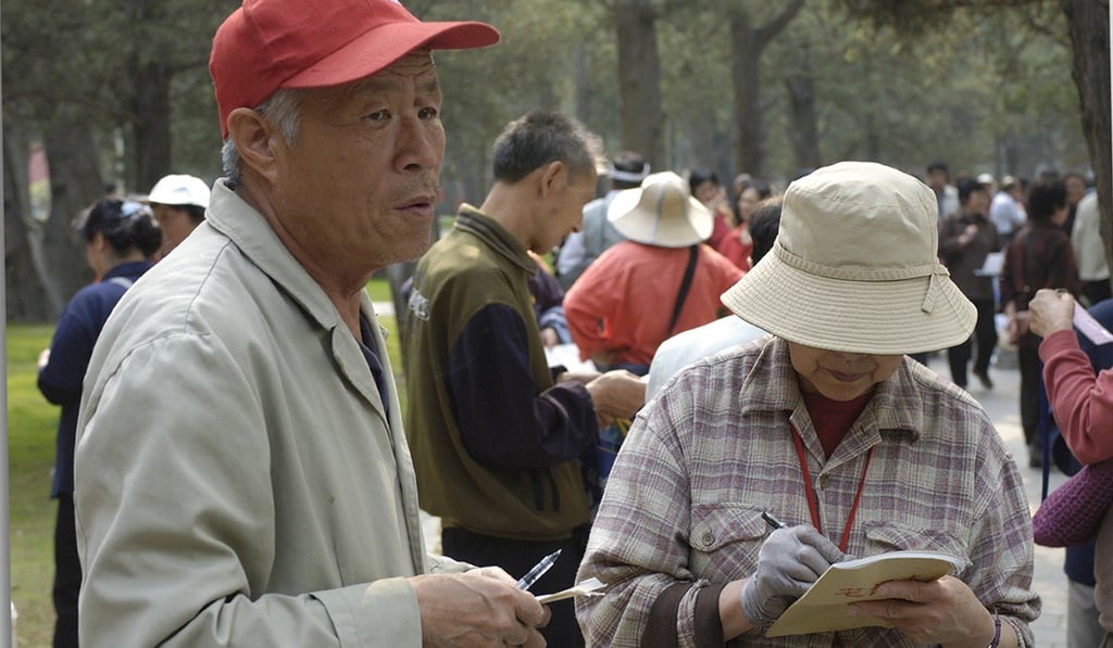 Parents have long traded details of prospective partners for their unmarried children in Zhongshan Park. Photo: Miriam Clifford