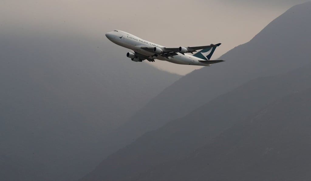 A Cathay Pacific flight is seen in the sky at Hong Kong International Airport. Photo: Nora Tam