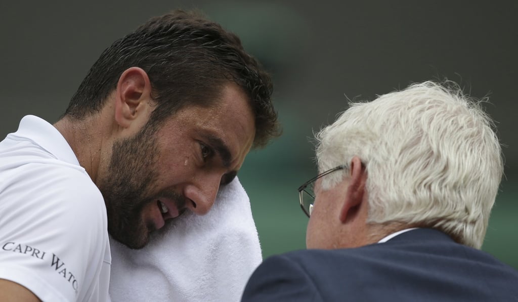 Croatia's Marin Cilic in tears during a medical time out. Photo: AP