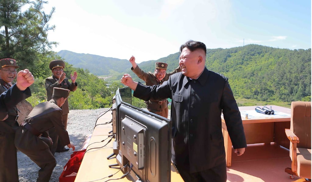 North Korean leader Kim Jong-un reacts after the test-firing of the intercontinental ballistic missile Hwasong-14, at an undisclosed location on July 4. This marked a watershed moment in Pyongyang’s push to develop a nuclear weapon capable of hitting the mainland United States. Photo: AFP/KCNA via KNS