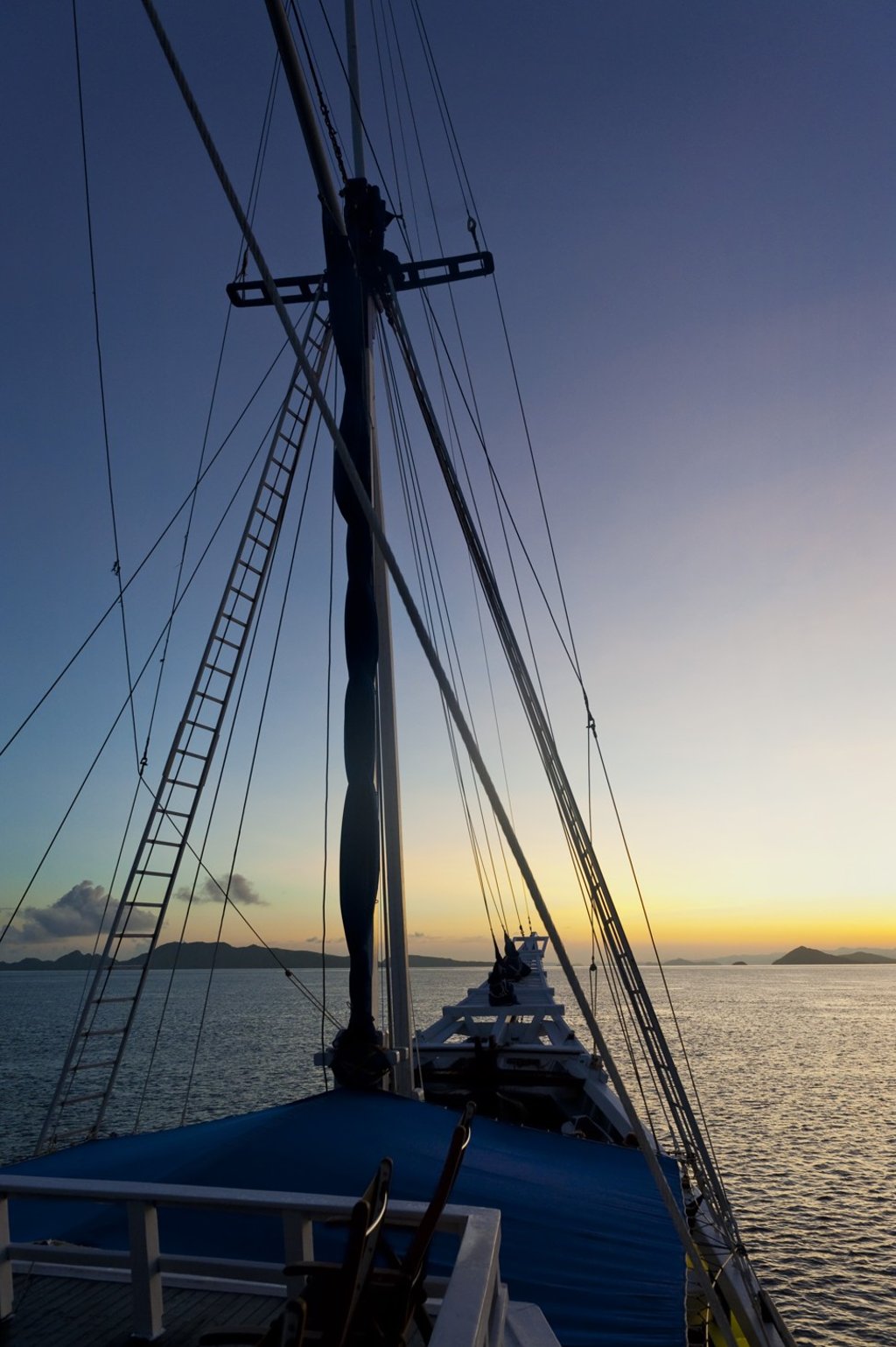A gorgeous sunrise from a traditional Indonesian phinisi sailboat during a trip through this Asian archipelago.