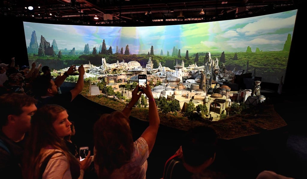 Fans view the new Star Wars park that will open at the California and Florida Disneylands in 2019 during the D23 expo fan convention at the Convention Center. Photo: AFP