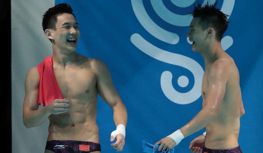 Chen Aisen and China's Yang Hao celebrate their victory. Photo: AFP Chen Aisen and China's Yang Hao celebrate their victory. Photo: AFP