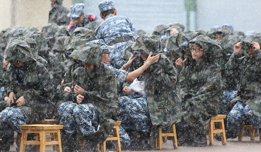 Torrential rain proves to be the first test for the new recruits. Photo: Dickson Lee