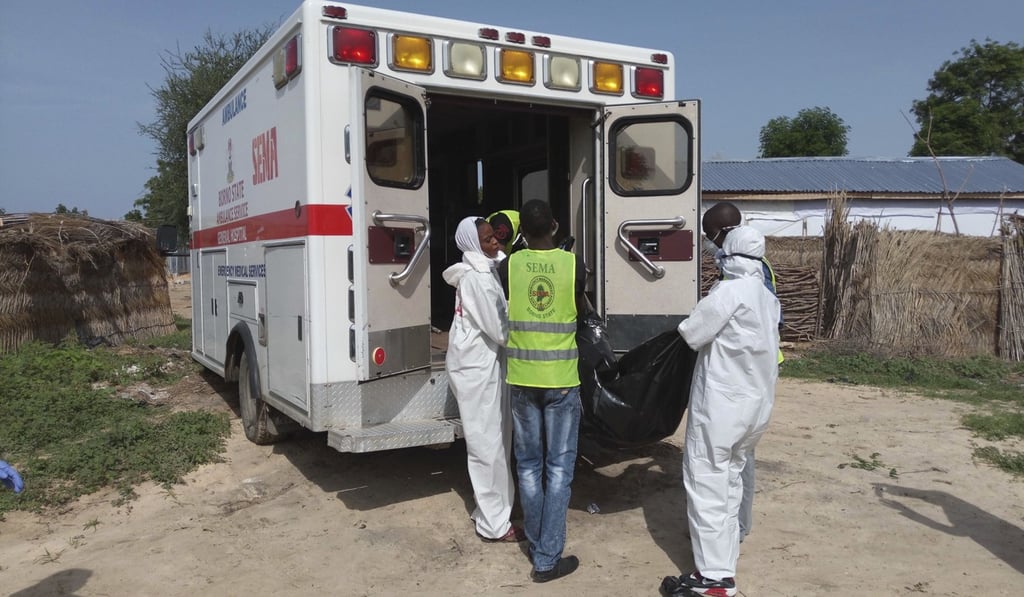 Rescuers load a body into an ambulance following a suspected Boko Haram suicide bomb attack in Maiduguri, Nigeria, on Monday. Photo: AP Rescuers load a body into an ambulance following a suspected Boko Haram suicide bomb attack in Maiduguri, Nigeria, on Monday. Photo: AP
