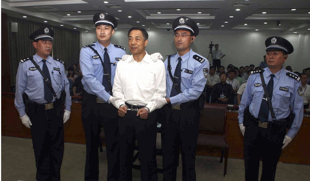 A handcuffed Bo Xilai awaits sentencing in Jinan, Shandong province, in September 2013. Bo was convicted on charges of taking bribes, embezzlement and abuse of power, and sentenced to life in prison. Photo: AP/Jinan Intermediate People’s Court