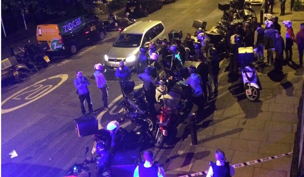 Emergency workers converge on the scene of an acid attack in London on July 13. Photo: Reuters