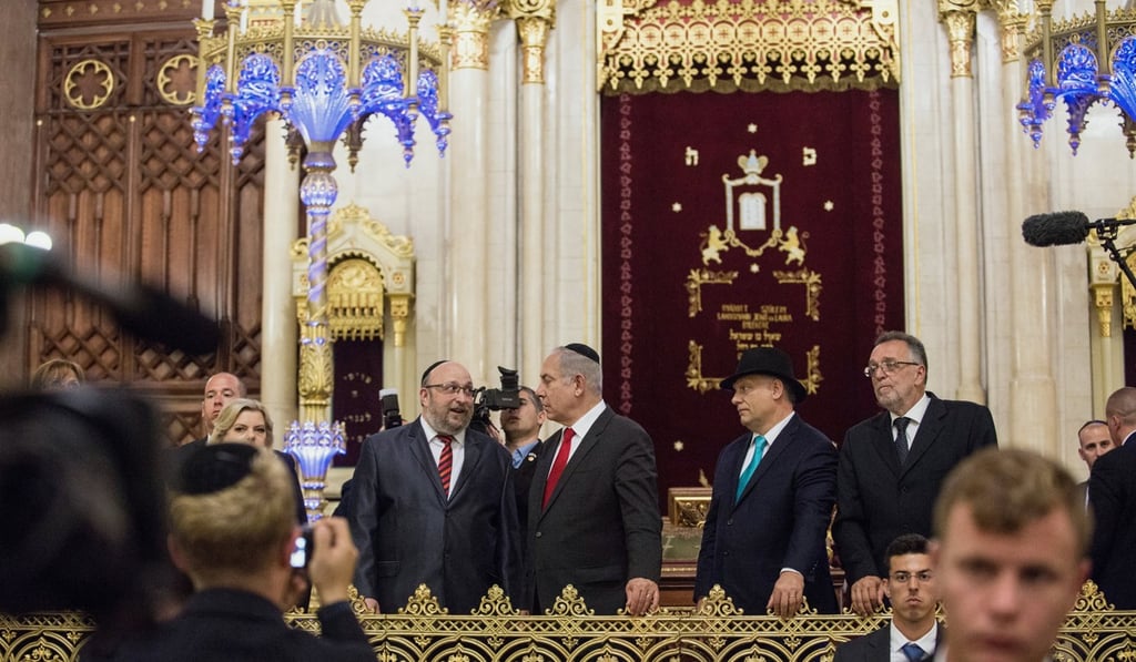 Israeli Prime Minister Benjamin Netanyahu (second left) chats with Chief Rabbi of Hungary Robert Froelich, as Hungarian Prime Minister Viktor Orban (second right) and President of the Federation of Jewish Religious Communities of Hungary Andras Heisler (right) visit the Dohany Street Synagogue in Budapest on Wednesday. Photo: EPA Israeli Prime Minister Benjamin Netanyahu (second left) chats with Chief Rabbi of Hungary Robert Froelich, as Hungarian Prime Minister Viktor Orban (second right) and President of the Federation of Jewish Religious Communities of Hungary Andras Heisler (right) visit the Dohany Street Synagogue in Budapest on Wednesday. Photo: EPA