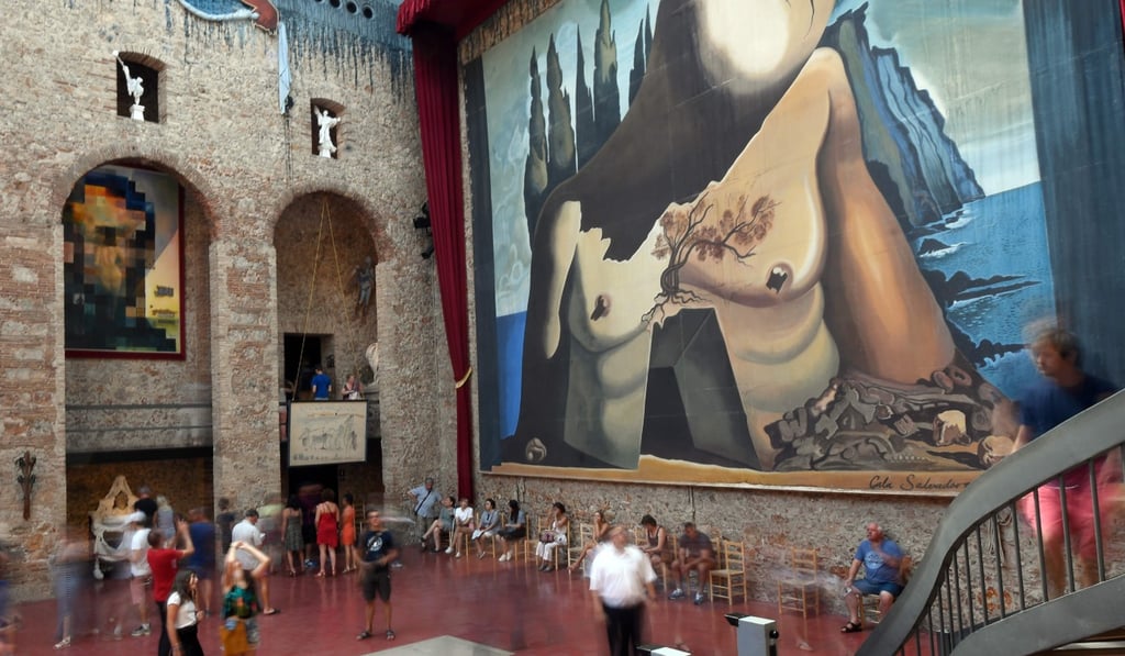 Visitors walk around Salvador Dali's tomb inside the Theatre-Museum Dali in Figueras. Photo: AFP