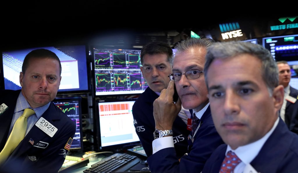 A screen displays trading information for German insurance firm Allianz on the floor of the New York Stock Exchange. Photo: Reuters