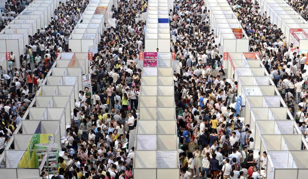 Thousands of job seekers at a career fair in Chongqing municipality, in October 2014. Photo: Reuters