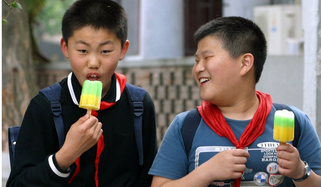 Boys eat ice lollies in this file photo. Zheng devoured 54 of the frozen treats before being told he might have a more serious problem than thirst. Photo: Handout Boys eat ice lollies in this file photo. Zheng devoured 54 of the frozen treats before being told he might have a more serious problem than thirst. Photo: Handout