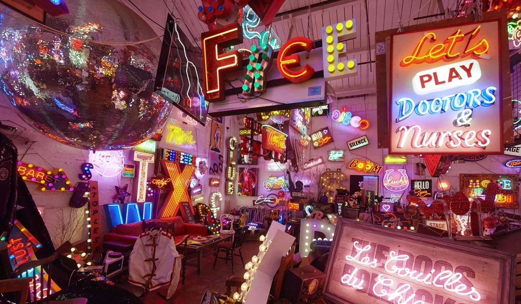 Some of the many neon lights and signs displayed inside God's Own Junkyard. Photo: AFP