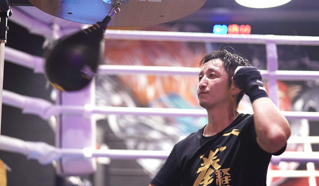 Zou Shiming works out on a speed bag in Shanghai. Zou Shiming works out on a speed bag in Shanghai.