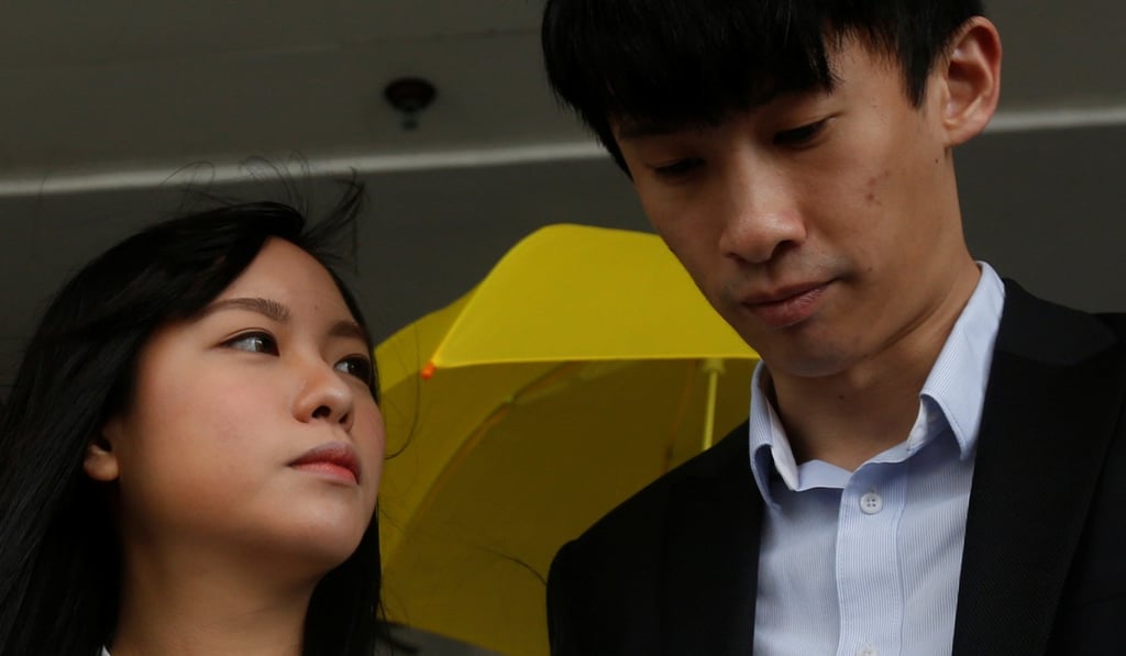 Pro-independence legislators Yau Wai-ching and Baggio Leung, the first two to be disqualified over oath-taking, outside Eastern Law Courts in Sai Wan Ho, on April 28. Photo: Reuters