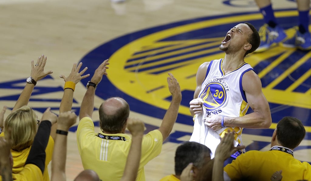 Golden State Warriors’ star Stephen Curry plays up to the crowd. Photo: AP