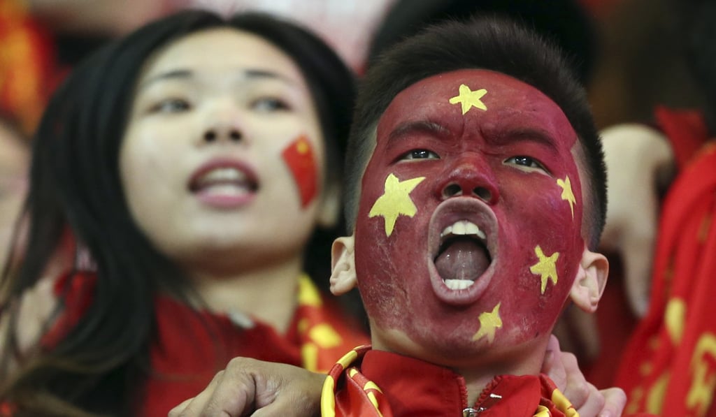 China soccer fans celebrate their team's 1-0 win over South Korea in the 2018 World Cup qualifier in March. Photo: AP