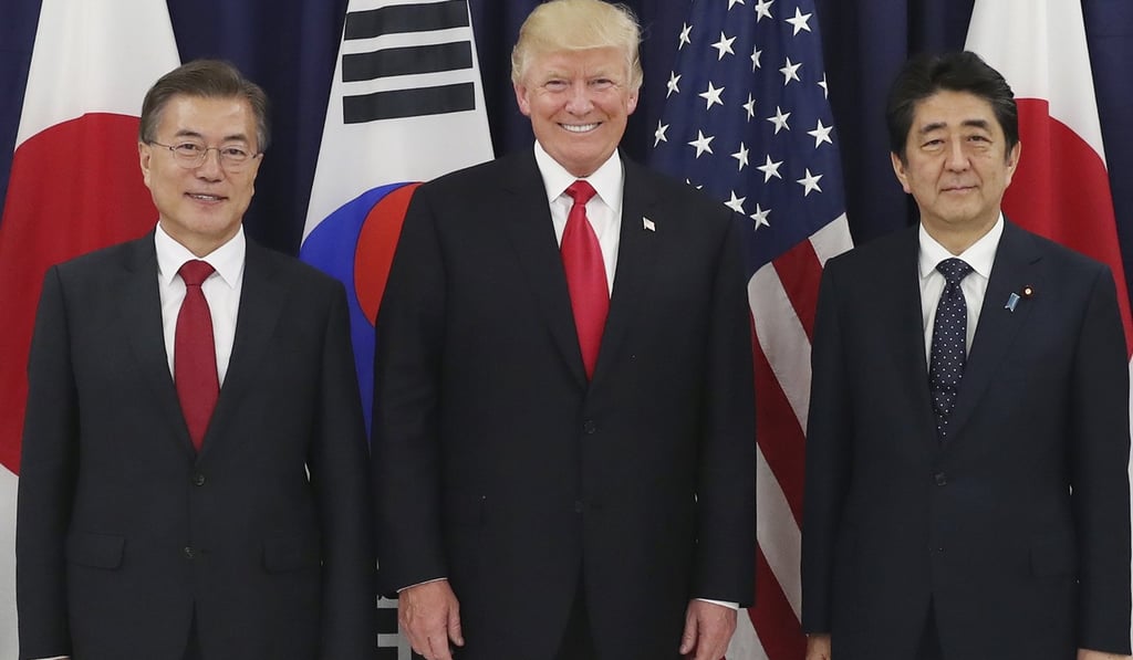 President Moon Jae-in of South Korea and Japanese Prime Minister Shinzo Abe with US President Donald Trump before a meeting in Hamburg on July 6. The three leaders agreed to get tougher on North Korea’s nuclear and missile programmes. Photo: EPA