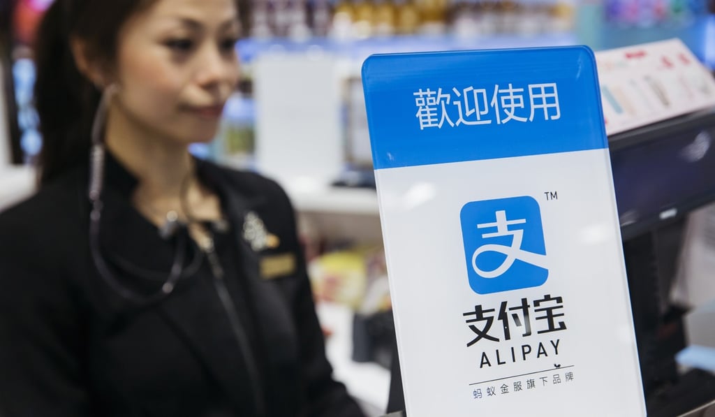 Signage for Ant Financial Services Group's Alipay, an affiliate of Alibaba Group Holding. The urgency to prepare regulatory environments for fintech is growing as banks begin offering digital services such as biometric authentication and as mobile-payment systems such as Apple Pay and AliPay are introduced around the region. Photographer: Bloomberg