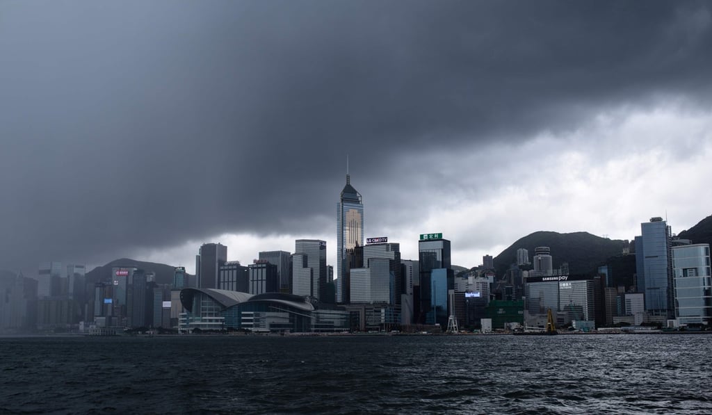 Dark clouds loom over the Hong Kong skyline as Typhoon Merbok approaches the city on June 12. Rain from the No 8 signal storm caused traffic chaos, flight delays and suspension of classes. Photo: AFP