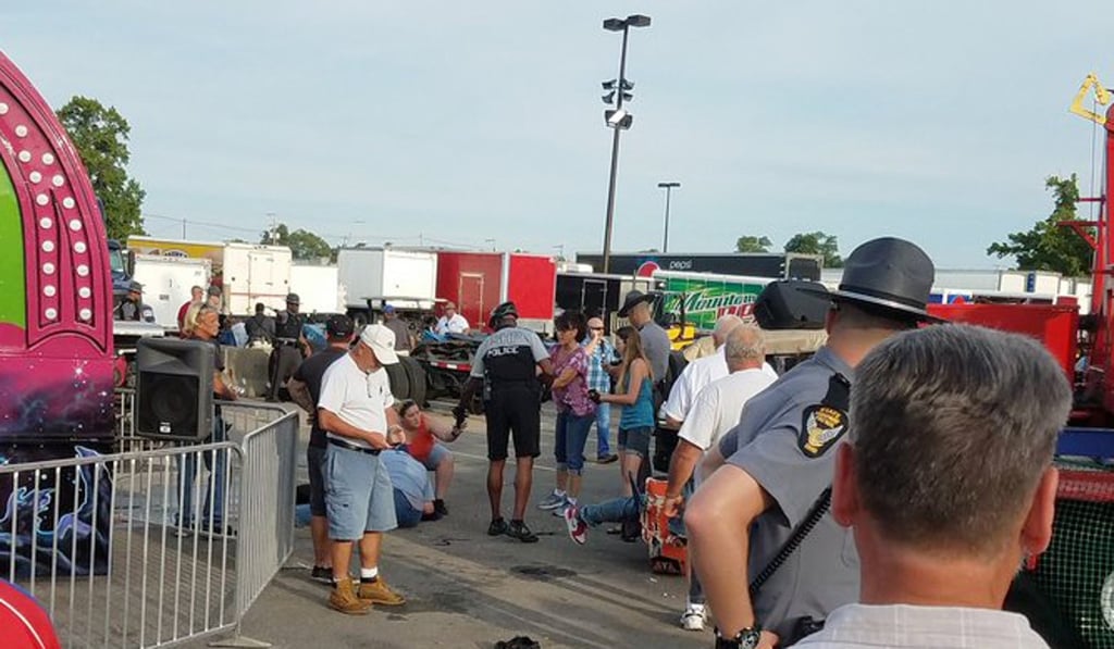 A person is treated afterthe Fire Ball amusement ride malfunctioned at the Ohio State Fair on Wednesday. Photo: AP