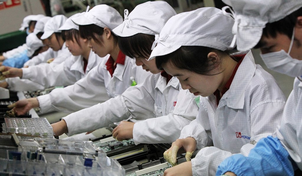 Workers inside a Foxconn factory in the township of Longhua in southern Guangdong province. Photo: David Wong