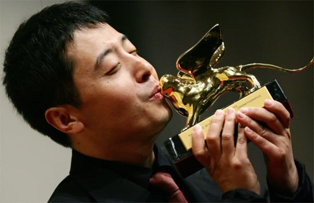 Jia Zhangke accepts the Golden Lion award in Venice in 2006. Picture: AFP