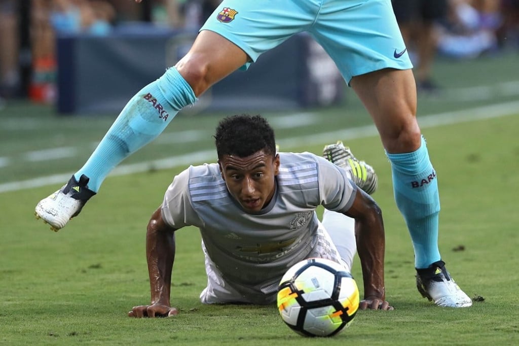 Manchester United’s Jesse Lingard and Ivan Rakitic of Barcelona battle for the ball in the International Champions Cup match. Photo: AFP