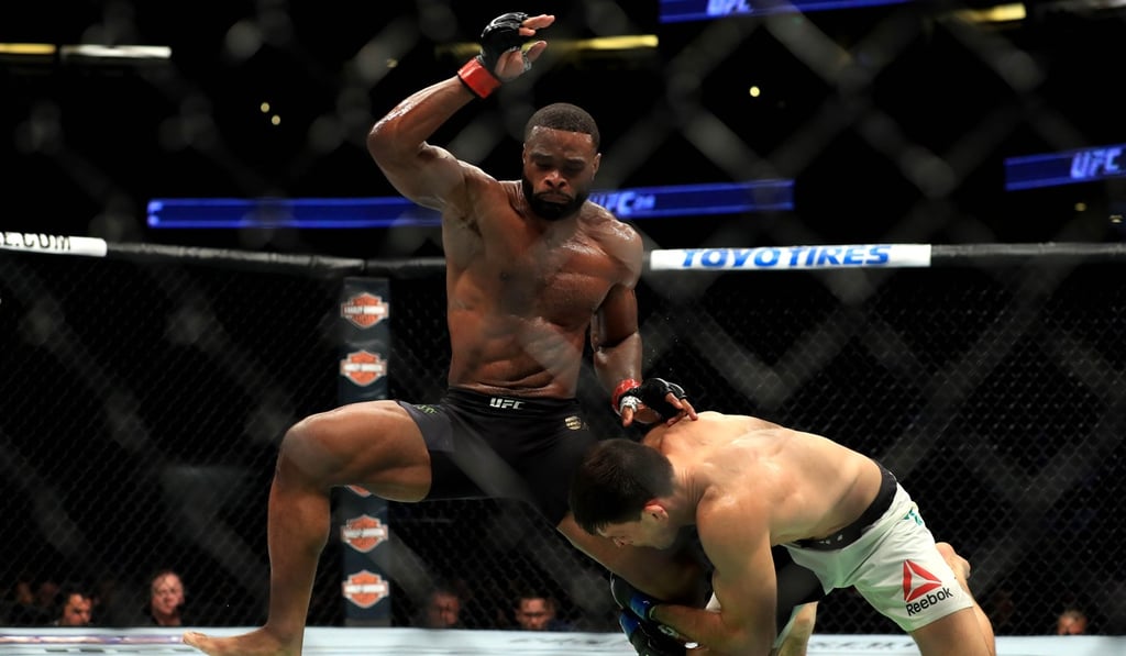 Tyron Woodley (left) defends an attempt at a takedown by Demian Maia. Photo: AFP
