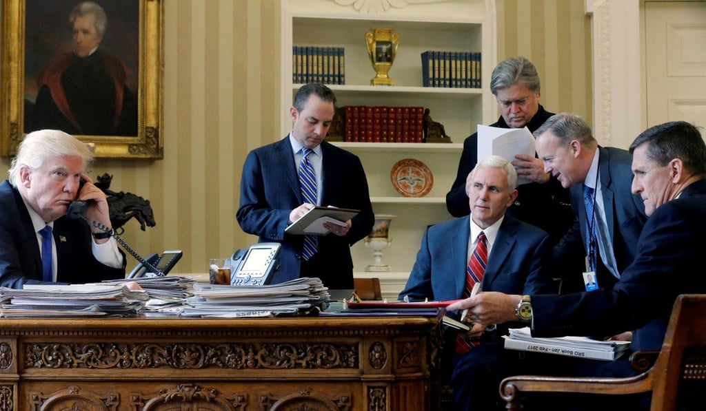 US President Donald Trump with (from left) then chief of staff Reince Priebus, Vice-President Mike Pence, senior adviser Steve Bannon, then communications director Sean Spicer and then national security adviser Michael Flynn, as he speaks by phone with Russian President Vladimir Putin in the Oval Office on January 28. Photo: Reuters