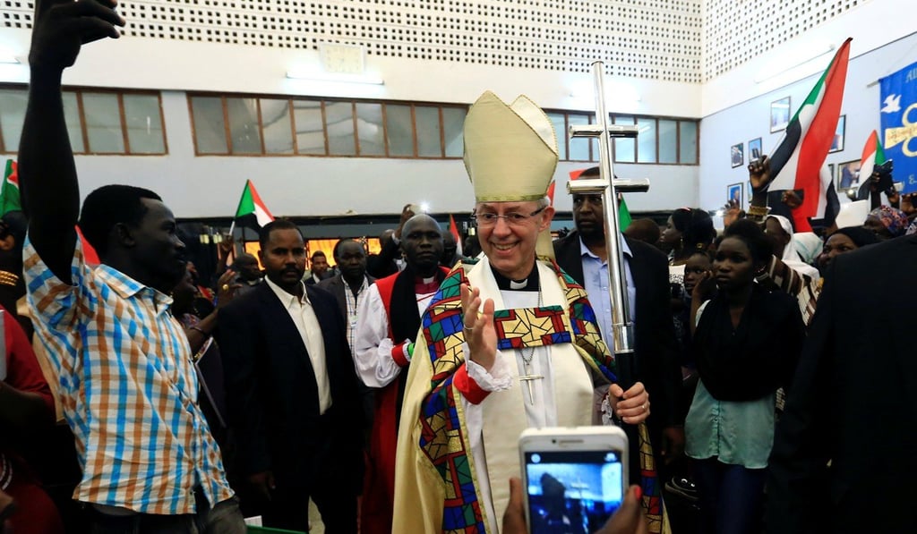 Archbishop of Canterbury Justin Welby waves to followers as he arrives for the inauguration of the 39th Province of the Anglican Communion in Khartoum, Sudan, on Sunday. Photo: Reuters