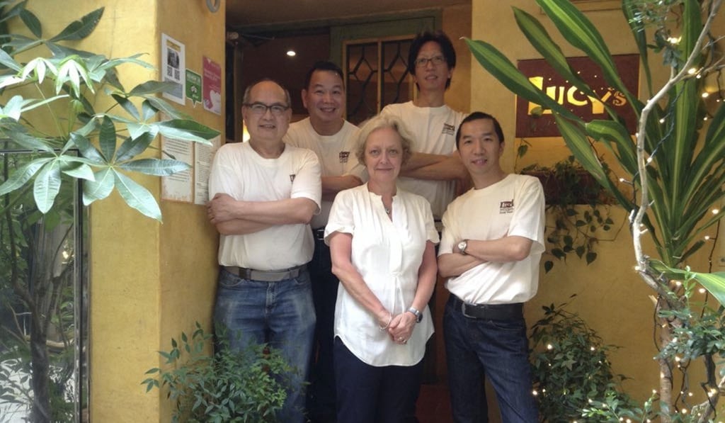 Lucy Humbert (front) with staff at her eponymous restaurant, which opened in Stanley in 1994. Photo: courtesy of Lucy's
