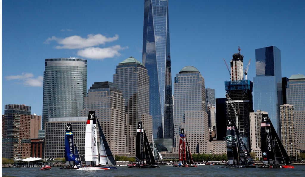 AC45F racing sailboats compete in race two of the America's Cup World Series sailing event below the One World Trade Center Tower and the lower Manhattan skyline in New York, Photo: Reuters