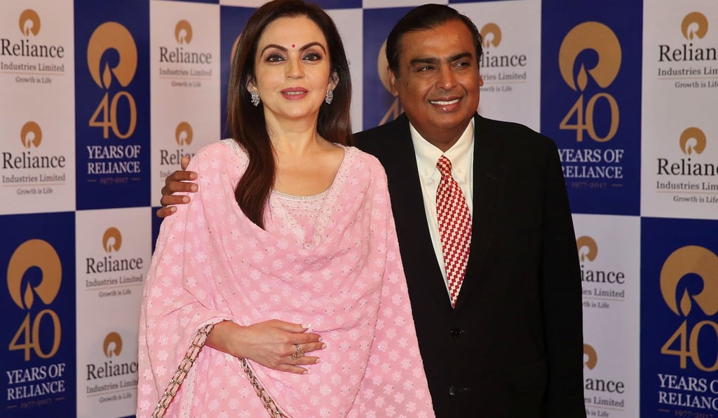 Mukesh Ambani, Chairman and Managing Director of Reliance Industries, poses with wife Nita Ambani before addressing the company's annual general meeting in Mumbai, India, on July 21, 2017. Photo: Reuters