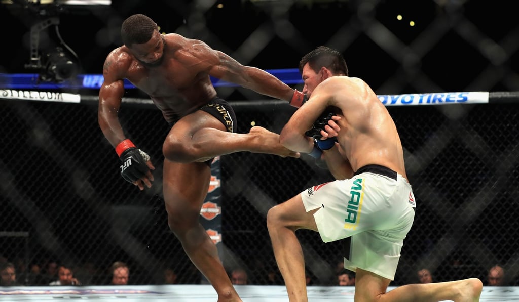 Tyron Woodley successfully blocks a takedown from Demian Maia – a strategy which proved successful, but light on entertainment. Photo: AFP Tyron Woodley successfully blocks a takedown from Demian Maia – a strategy which proved successful, but light on entertainment. Photo: AFP